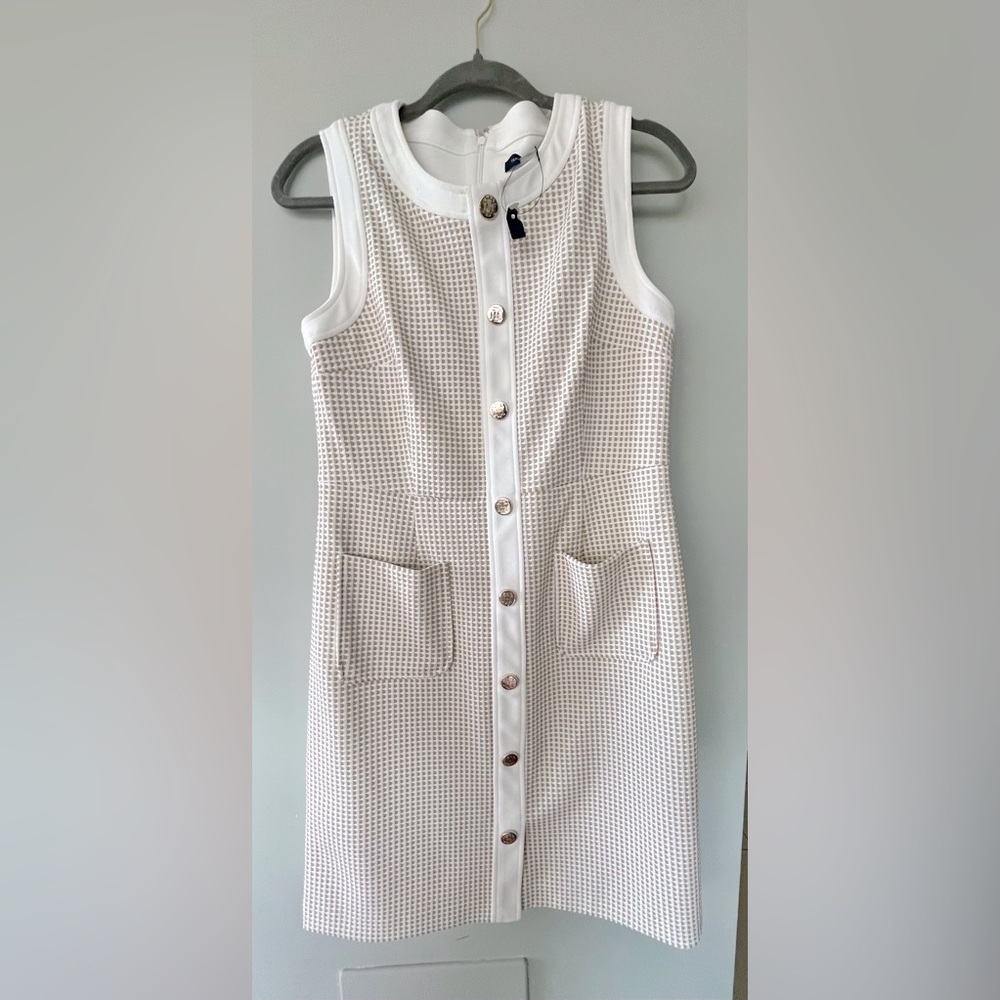 Gold buttons on this classic style dress your best